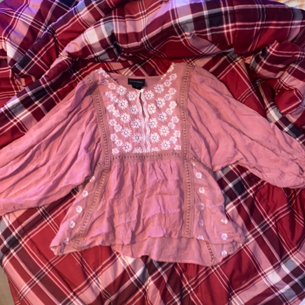 Coral like color blouse with white flowers